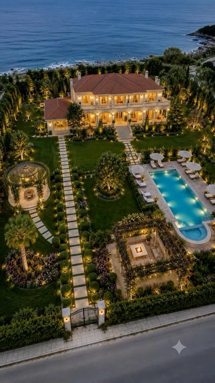 15 Acreage Garden Ideas for Large Land That Works 7 Aerial view of a luxury coastal estate with a swimming pool and manicured gardens.