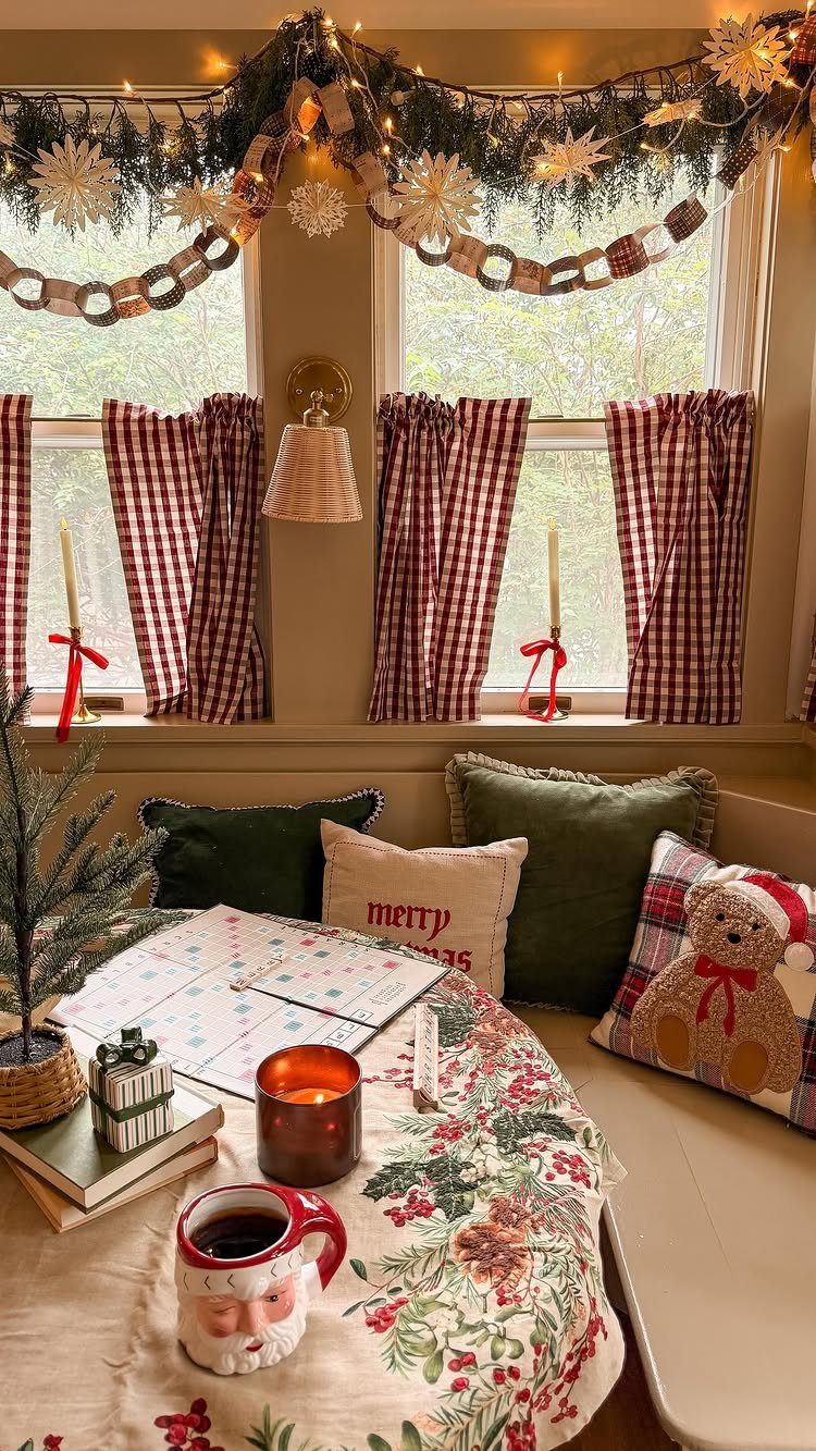 Christmas Decor Aesthetic: 13 Looks to Try This Season 12 Cozy Christmas interior with red gingham curtains, festive tablecloth, and holiday decorations near a window.