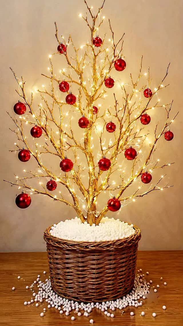 Christmas Dinner and Table Decorations: 9 Ideas for Setting the Scene 6 Golden branch tree decorated with red ornaments and fairy lights in a wicker basket.