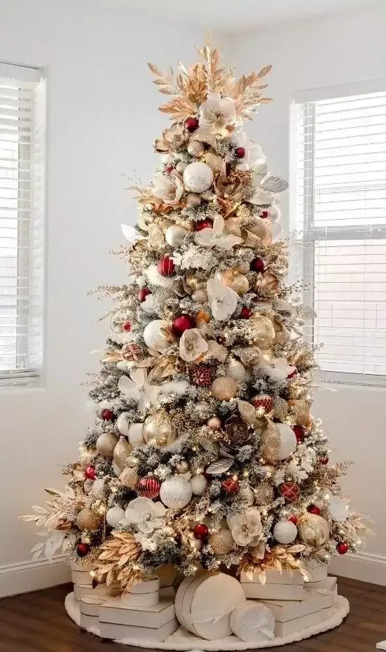8 Christmas Tree Red and White Gold Decor Ideas for Holiday Elegance 7 Decorated Christmas tree with white, gold, and red ornaments and large white flowers.