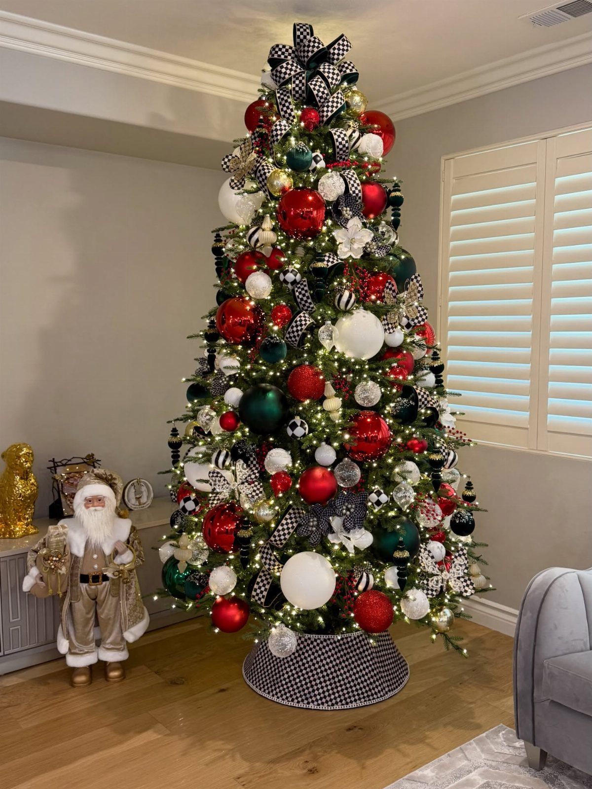 Christmas Tree Ribbon: 18 Styling Ideas That Work 12 Decorated Christmas tree with red, white, and green ornaments and black and white checkered ribbons.