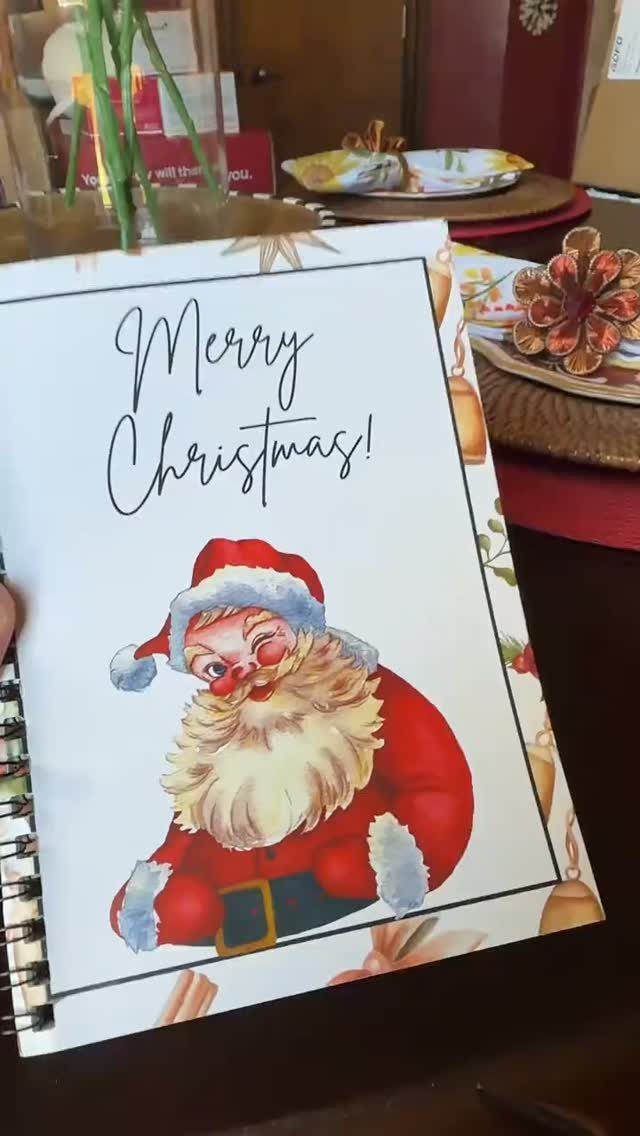 27 DIY Cheap Christmas Gifts for 2026 18 A spiral notebook with a festive Santa Claus illustration and Merry Christmas text.
