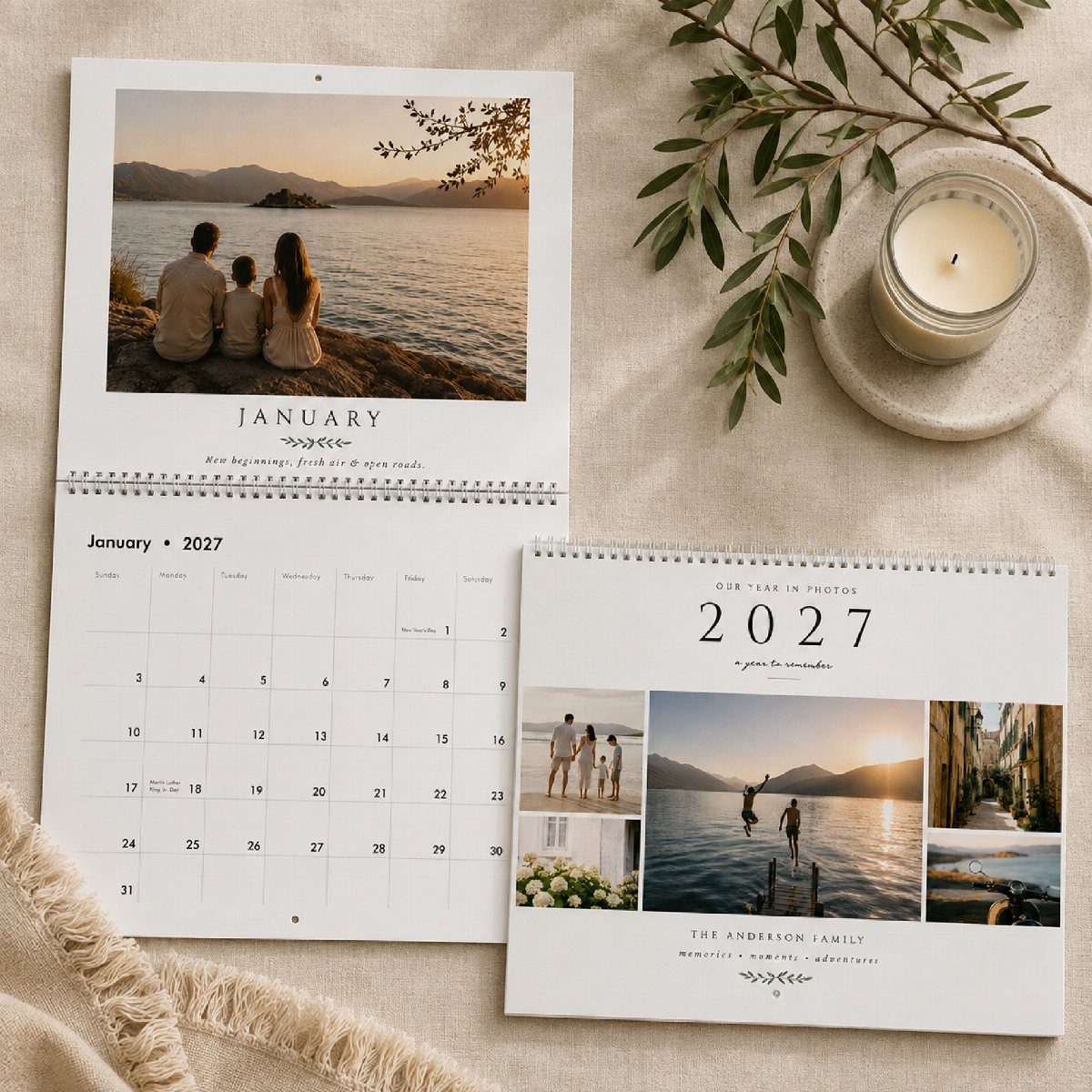 27 DIY Cheap Christmas Gifts for 2026 14 Two spiral-bound photo calendars displaying family pictures and 2027 dates on a beige fabric surface.