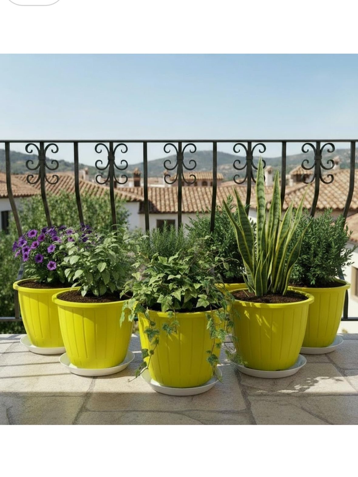 20 Plant Pot Ideas for Outdoor Spaces That Actually Work 16 Five bright yellow planters with various green plants arranged on a stone balcony.