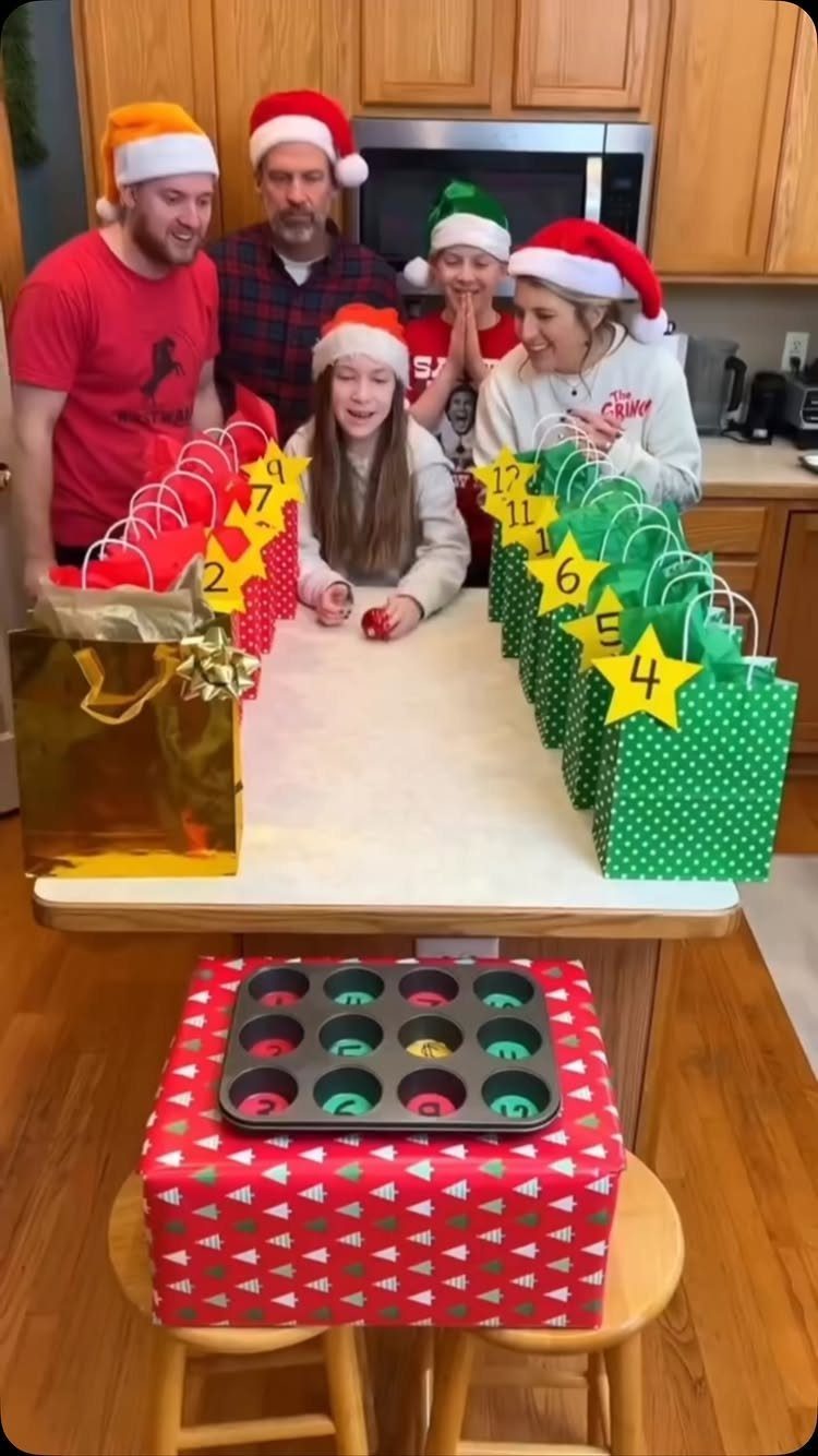 21 Things to Do for Christmas 2026 18 People wearing Santa hats gather around a table with numbered green gift bags.