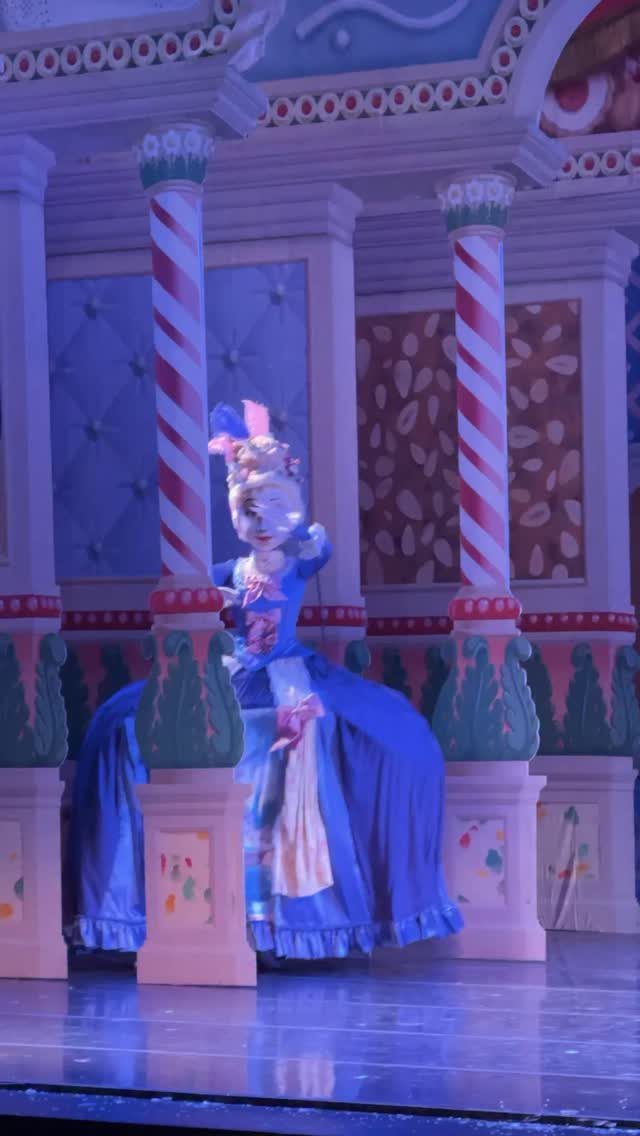 21 Things to Do for Christmas 2026 7 A ballet dancer in a blue costume performs on a candy-themed stage set.